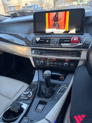 BMW 5-Serie GT F07 09-17 - 12,3" Radio m. Apple CarPlay og Android Auto installed in a car interior.